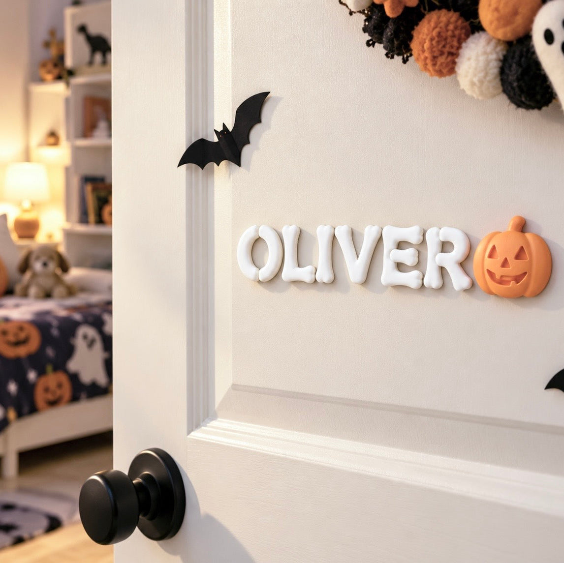 Personalized Halloween name sign with white 3D bone letters spelling OLIVER and an orange pumpkin accent displayed on a child’s bedroom door.
by The Homenko Studio, Calgary, Canada