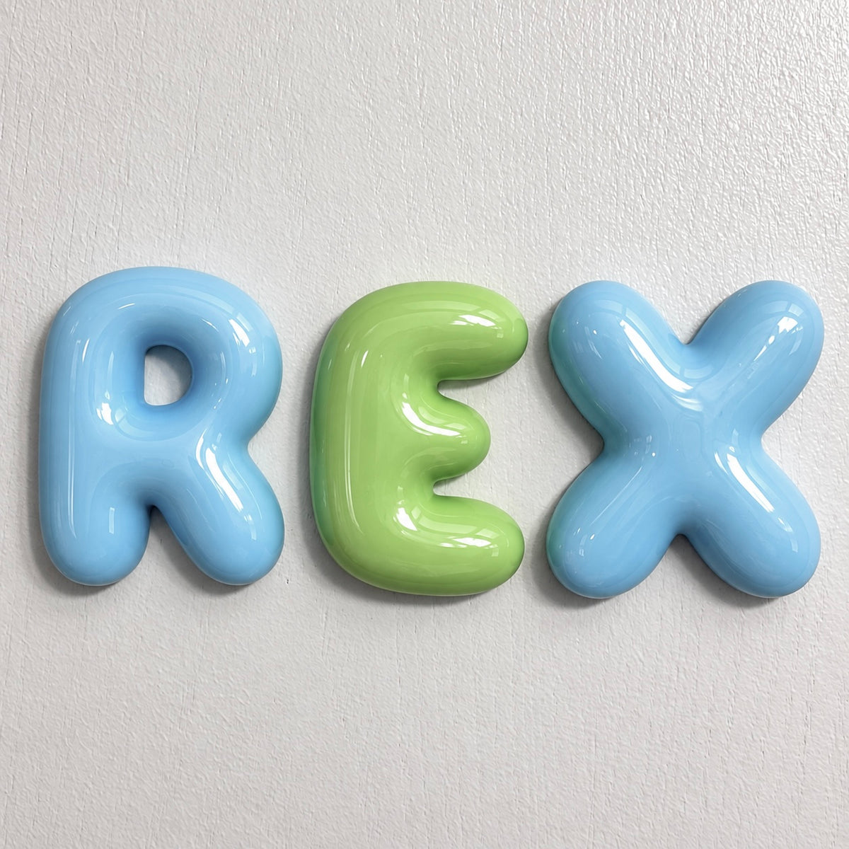 Personalized boys name sign with glossy blue and green 3D bubble letters for kids room wall decor
by The Homenko Studio, Calgary, Canada