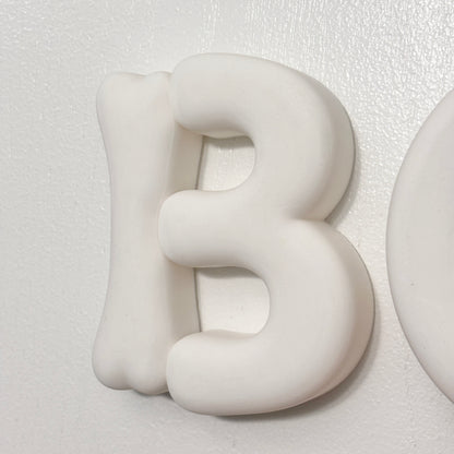 Close-up of chunky rounded 3D BOO letters for Halloween decor